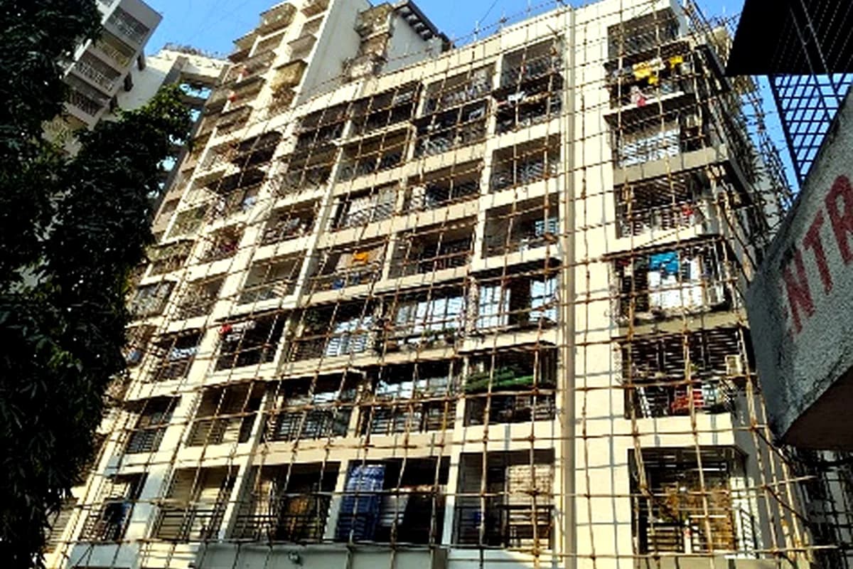 Society building repair under scaffolding - Sana Heights Co. Op. Hsg. Soc. Ltd.