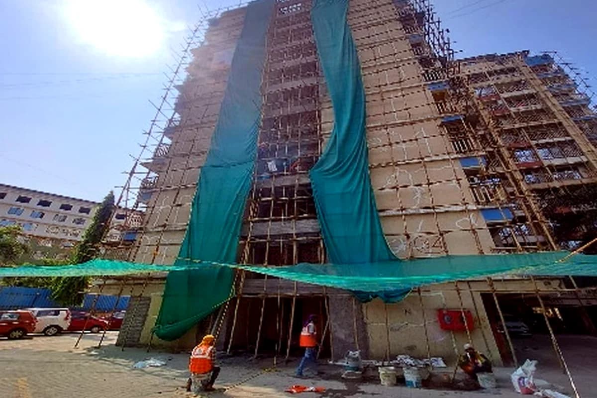 High-rise repair work with safety netting - Narendra Park Venus Co. Op. Hsg. Soc. Ltd.